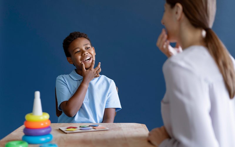 Child practicing speech sounds