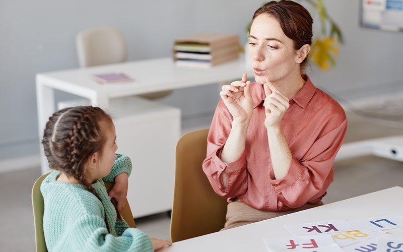 Child learning to speak clearly